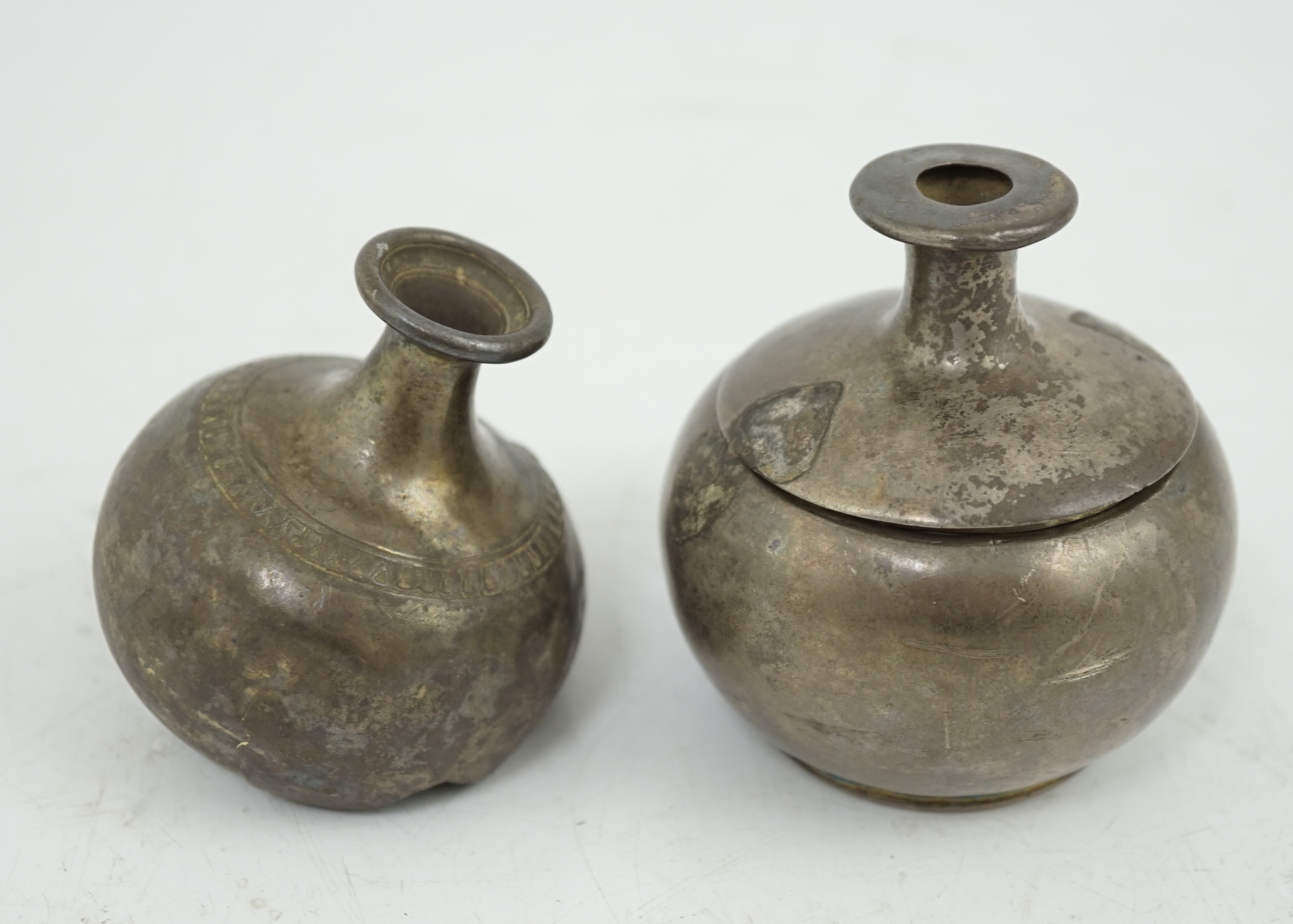 Three silver aryballoi, incomplete, Roman or Gandhara, c. late 1st century BC - early 1st century A.D.
